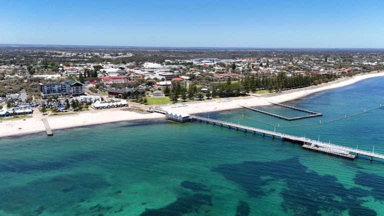 Stunning aerial view of Busselton Jetty and coastline in Western Australia. Perfect vacation destination.