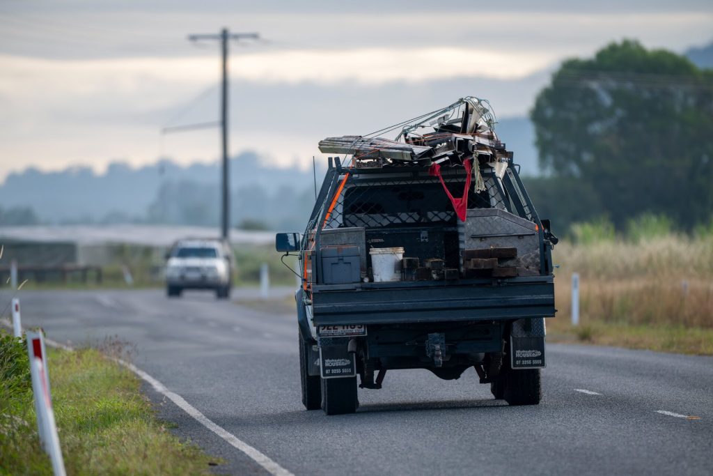 Loaded ute driving on rural country road